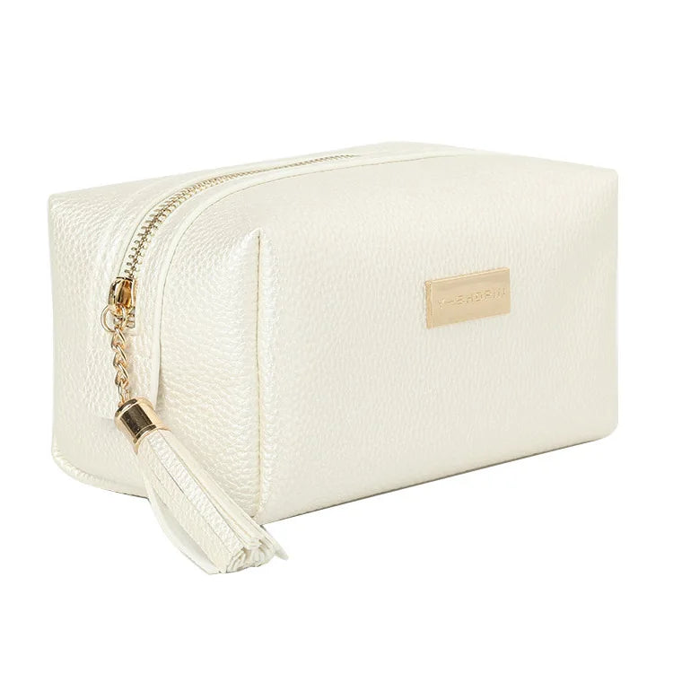 Wholesale Elegant Korean Travel Plain Faux Leather Makeup Pouch Gold Zipper Pink Cosmetic Bag With Tassel