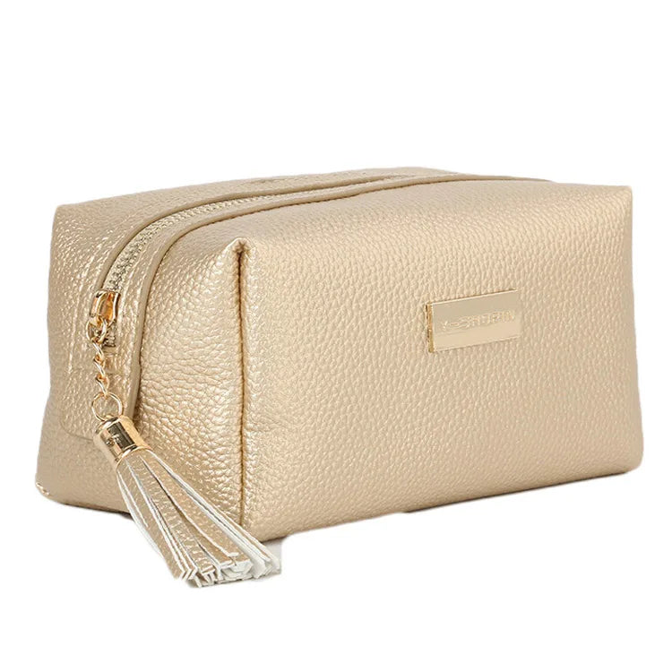 Wholesale Elegant Korean Travel Plain Faux Leather Makeup Pouch Gold Zipper Pink Cosmetic Bag With Tassel