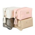 Wholesale Elegant Korean Travel Plain Faux Leather Makeup Pouch Gold Zipper Pink Cosmetic Bag With Tassel